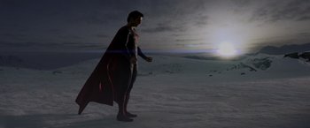 Movie still from “Man of Steel” (2013), directed by Zack Snyder – A man standing in the middle of a field; Wide shot, Low angle