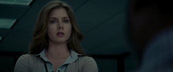 Movie still from “Man of Steel” (2013), directed by Zack Snyder – A person with long hair; Close Up shot, Over the shoulder angle