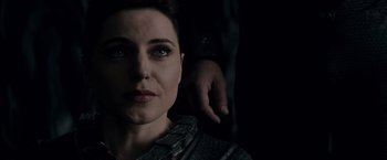 Movie still from “Man of Steel” (2013), directed by Zack Snyder – A woman and a man standing next to each other in the dark; Close Up shot, Over the shoulder angle