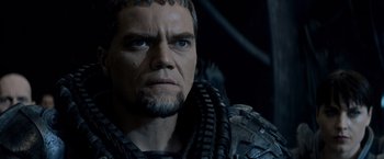 Movie still from “Man of Steel” (2013), directed by Zack Snyder – A person wearing a costume; Close Up shot, Over the shoulder angle