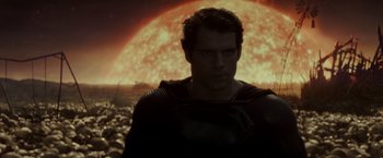 Movie still from “Man of Steel” (2013), directed by Zack Snyder – A man in a black shirt and a red and black shirt; Medium shot, Over the shoulder angle
