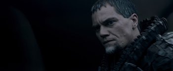 Movie still from “Man of Steel” (2013), directed by Zack Snyder – A person with a beard; Close Up shot, Over the shoulder angle