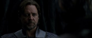 Movie still from “Man of Steel” (2013), directed by Zack Snyder – A person with a beard; Close Up shot, Over the shoulder angle