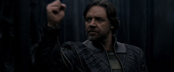 Movie still from “Man of Steel” (2013), directed by Zack Snyder – A person holding something in his hand; Close Up shot, Low angle