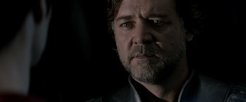 Movie still from “Man of Steel” (2013), directed by Zack Snyder – A person wearing a black shirt; Close Up shot, Low angle