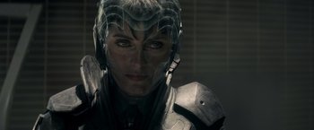 Movie still from “Man of Steel” (2013), directed by Zack Snyder – A person wearing a helmet; Close Up shot, Over the shoulder angle