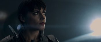 Movie still from “Man of Steel” (2013), directed by Zack Snyder – A person with short black hair; Close Up shot, Over the shoulder angle