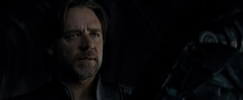 Movie still from “Man of Steel” (2013), directed by Zack Snyder – A person with a beard; Close Up shot, Over the shoulder angle