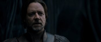 Movie still from “Man of Steel” (2013), directed by Zack Snyder – A person with a beard; Close Up shot, Over the shoulder angle