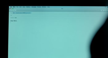 Movie still from “Manchester by the Sea” (2016), directed by Kenneth Lonergan – A computer screen with a blue background; Extreme Wide shot, High angle
