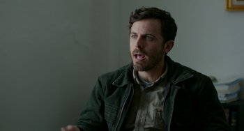 Movie still from “Manchester by the Sea” (2016), directed by Kenneth Lonergan – A person wearing a jacket; Close Up shot, Over the shoulder angle