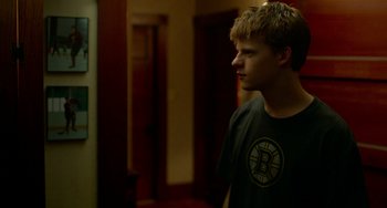 Movie still from “Manchester by the Sea” (2016), directed by Kenneth Lonergan – A young man standing in front of a mirror; Medium shot, Over the shoulder angle