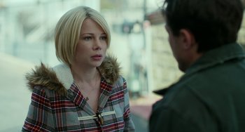 Movie still from “Manchester by the Sea” (2016), directed by Kenneth Lonergan – A woman in a plaid jacket talking to a man; Close Up shot, Over the shoulder angle