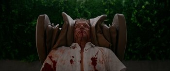 Movie still from “Margaux” (2022), directed by Steven C. Miller – A man with blood all over his face and head; Medium shot, High angle