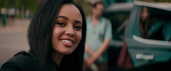 Movie still from “Margaux” (2022), directed by Steven C. Miller – A person smiling; Close Up shot, Over the shoulder angle