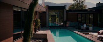 Movie still from “Margaux” (2022), directed by Steven C. Miller – A swimming pool in the middle of a house; Extreme Wide shot, High angle