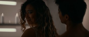 Movie still from “Margaux” (2022), directed by Steven C. Miller – A woman with long brown hair is looking at a man; Close Up shot, Over the shoulder angle