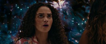 Movie still from “Margaux” (2022), directed by Steven C. Miller – A person with curly hair looking surprised; Close Up shot, Low angle