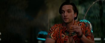 Movie still from “Margaux” (2022), directed by Steven C. Miller – A person wearing a colorful shirt; Close Up shot, Over the shoulder angle