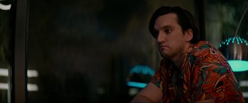 Movie still from “Margaux” (2022), directed by Steven C. Miller – A person wearing a colorful shirt; Close Up shot, Low angle