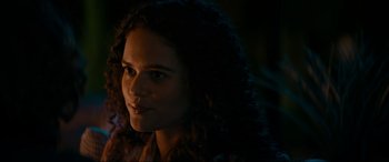 Movie still from “Margaux” (2022), directed by Steven C. Miller – A person with curly hair; Close Up shot, Over the shoulder angle