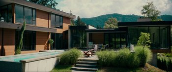 Movie still from “Margaux” (2022), directed by Steven C. Miller – A house that has a pool in the back yard; Extreme Wide shot, High angle