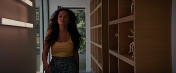 Movie still from “Margaux” (2022), directed by Steven C. Miller – A woman standing in a room with her eyes wide open; Medium shot, Low angle