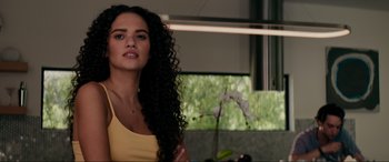 Movie still from “Margaux” (2022), directed by Steven C. Miller – A beautiful woman with long black curly hair; Close Up shot, Over the shoulder angle