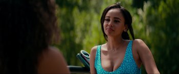 Movie still from “Margaux” (2022), directed by Steven C. Miller – A woman in a blue dress talking to someone; Close Up shot, Over the shoulder angle