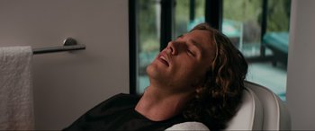 Movie still from “Margaux” (2022), directed by Steven C. Miller – A person laying on a bed; Close Up shot, High angle