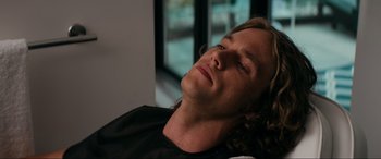 Movie still from “Margaux” (2022), directed by Steven C. Miller – A person laying on a bed; Close Up shot, Low angle