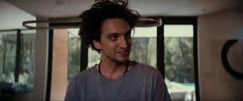 Movie still from “Margaux” (2022), directed by Steven C. Miller – A person with long hair; Close Up shot, Over the shoulder angle