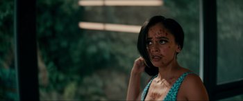 Movie still from “Margaux” (2022), directed by Steven C. Miller – A young woman with a bunch of blood on her face; Close Up shot, High angle