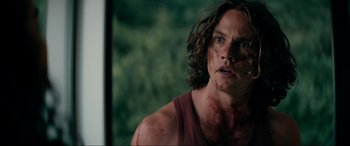 Movie still from “Margaux” (2022), directed by Steven C. Miller – A person with blood all over his face; Close Up shot, Over the shoulder angle