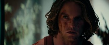 Movie still from “Margaux” (2022), directed by Steven C. Miller – A person with blood on his face; Close Up shot, Over the shoulder angle