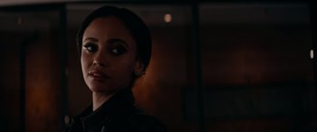 Movie still from “Margaux” (2022), directed by Steven C. Miller – A person wearing a black shirt; Close Up shot, Over the shoulder angle