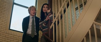 Movie still from “Marry Me” (2022), directed by Kat Coiro – A man and a woman standing next to a railing; Medium shot, Low angle