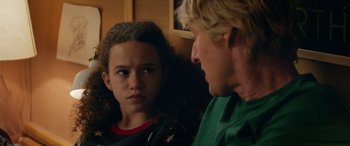 Movie still from “Marry Me” (2022), directed by Kat Coiro – A man and a girl are looking at each other; Close Up shot, Over the shoulder angle