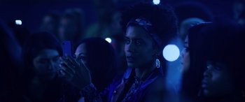 Movie still from “Marry Me” (2022), directed by Kat Coiro – A man in a dark room holding a cell phone up to his ear; Close Up shot, Low angle