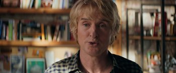 Movie still from “Marry Me” (2022), directed by Kat Coiro – A person wearing a plaid shirt; Close Up shot, Over the shoulder angle