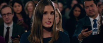 Movie still from “Marry Me” (2022), directed by Kat Coiro – A person with long brown hair; Close Up shot, Over the shoulder angle