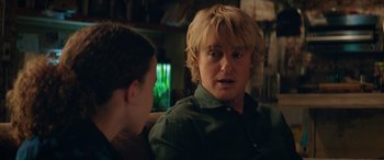 Movie still from “Marry Me” (2022), directed by Kat Coiro – A man with blonde hair talking to another man; Close Up shot, Over the shoulder angle