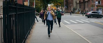 Movie still from “Marry Me” (2022), directed by Kat Coiro – A group of people walking down a sidewalk; Wide shot, High angle