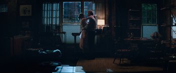 Movie still from “Marry Me” (2022), directed by Kat Coiro – A man and a woman dancing in front of a window; Wide shot, Low angle