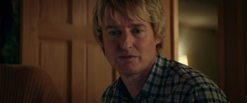 Movie still from “Marry Me” (2022), directed by Kat Coiro – A person wearing a plaid shirt; Close Up shot, Over the shoulder angle