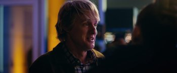 Movie still from “Marry Me” (2022), directed by Kat Coiro – A person wearing a plaid shirt; Close Up shot, Over the shoulder angle