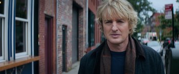 Movie still from “Marry Me” (2022), directed by Kat Coiro – A person wearing a scarf; Close Up shot, Low angle