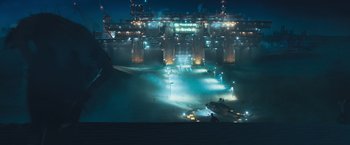 Movie still from “Maze Runner: The Scorch Trials” (2015), directed by Wes Ball – An image of an industrial area at night time; Extreme Wide shot, High angle