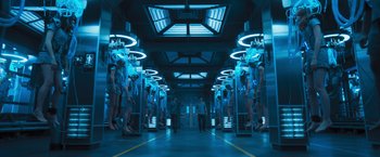 Movie still from “Maze Runner: The Scorch Trials” (2015), directed by Wes Ball – People are standing in a room with lights on the ceiling; Wide shot, Low angle