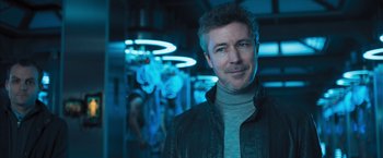 Movie still from “Maze Runner: The Scorch Trials” (2015), directed by Wes Ball – A person wearing a jacket in a room; Close Up shot, Low angle